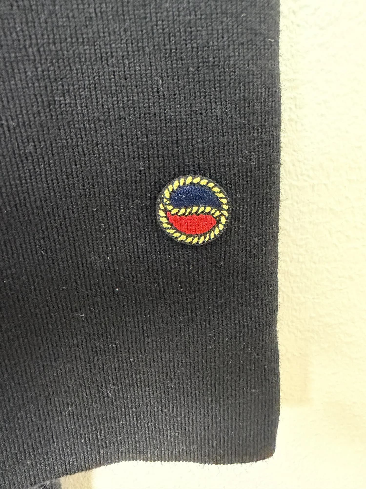 Busnels broderade märke